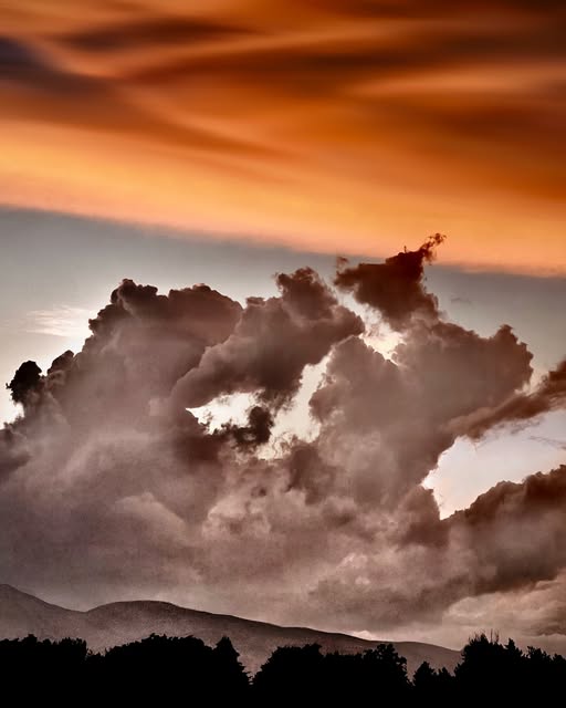 Photograph by Chuck Thurston: Two kinds of clouds
